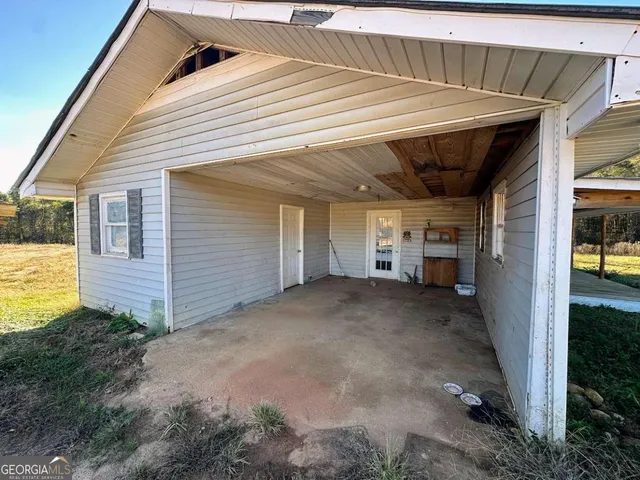 a kitchen with stainless steel appliances a refrigerator a stove top oven a sink dishwasher and wooden cabinets with wooden floor