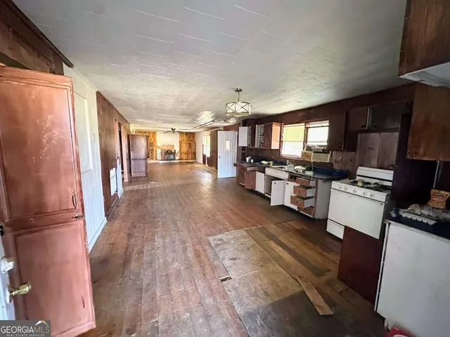 a view of a hardwood floor in a kitchen