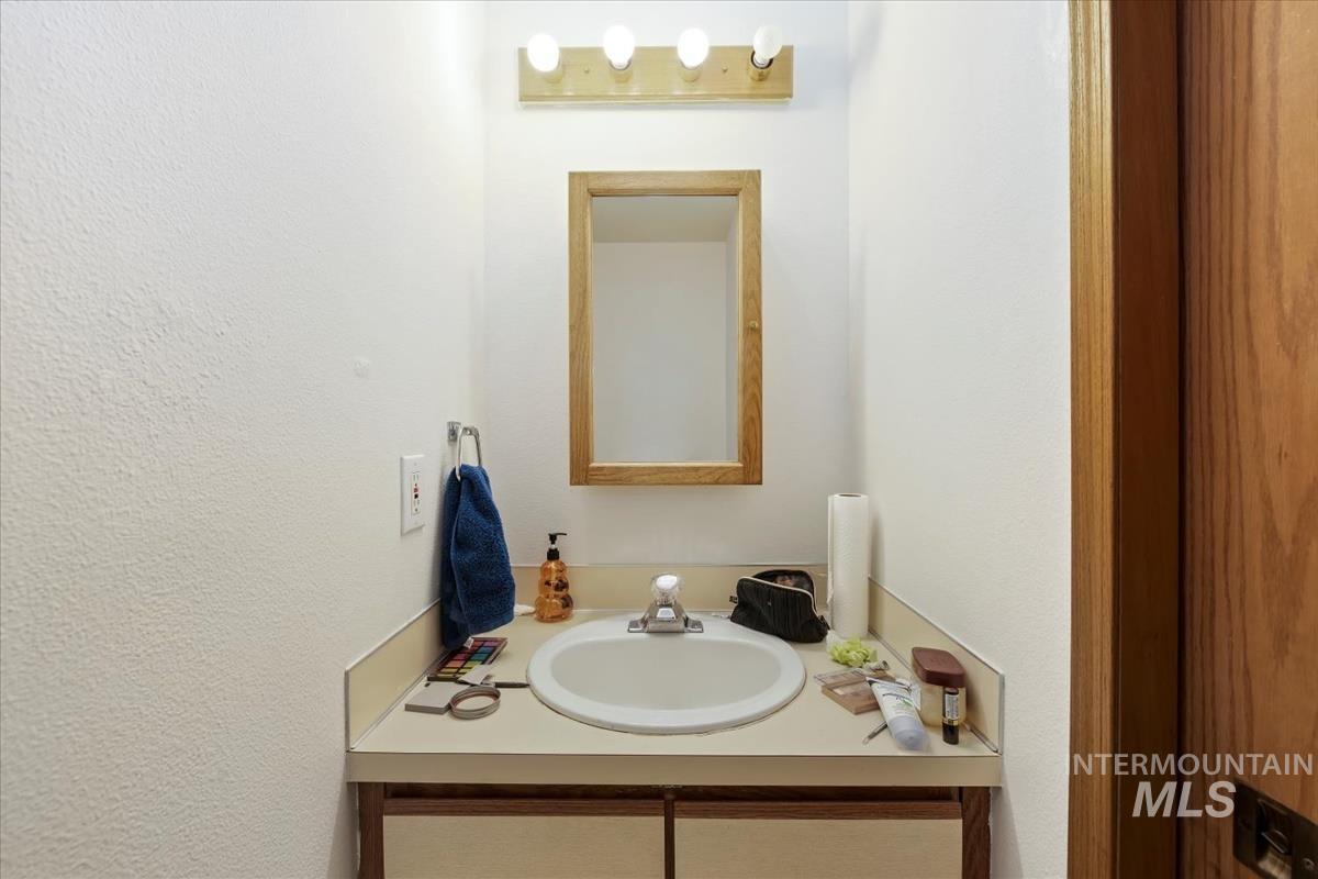 33 South Mike Street Boise, ID 83705 - Photo 16 of 50 Bathroom with vanity and a textured wall