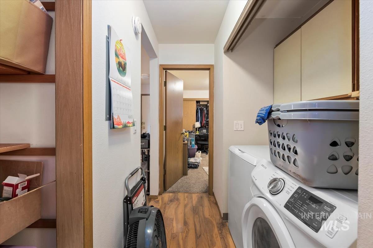 33 South Mike Street Boise, ID 83705 - Photo 23 of 50 Laundry area with dark wood-type flooring and washing machine and dryer