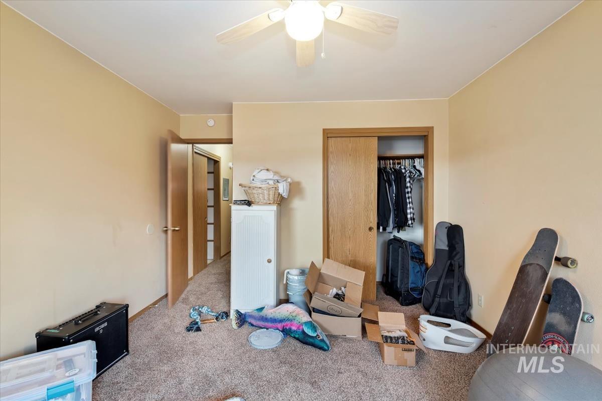 33 South Mike Street Boise, ID 83705 - Photo 26 of 50 Bedroom featuring a closet, carpet floors, and a ceiling fan