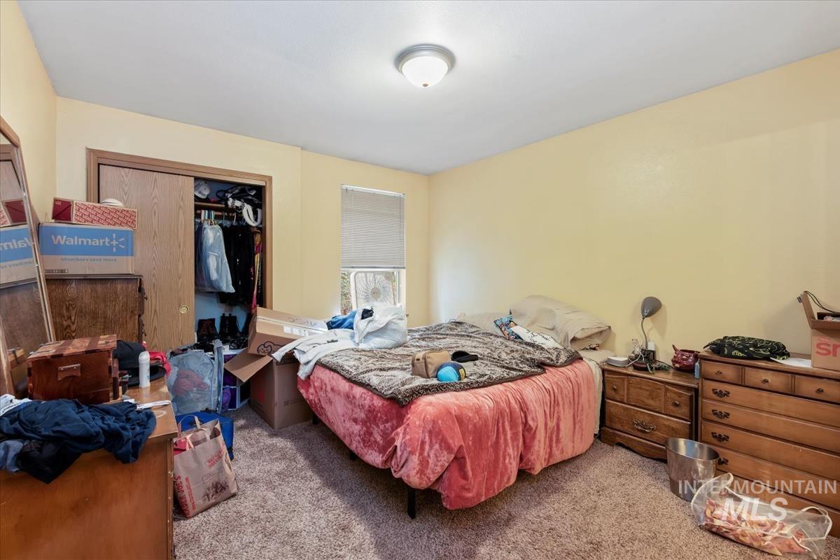 33 South Mike Street Boise, ID 83705 - Photo 30 of 50 Bedroom with carpet floors and a closet