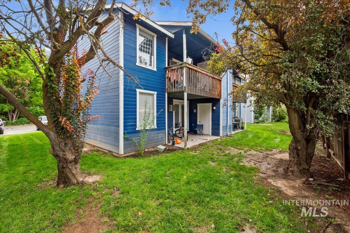 33 South Mike Street Boise, ID 83705 - Photo 3 of 50 Back of property featuring a yard, a patio, and a deck