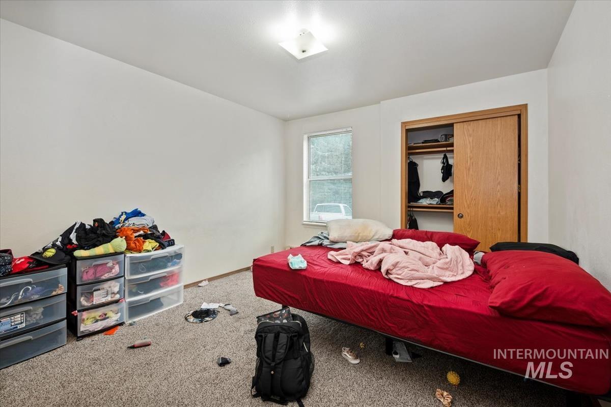 33 South Mike Street Boise, ID 83705 - Photo 39 of 50 Bedroom with carpet floors and a closet