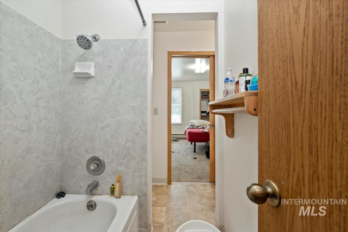 33 South Mike Street Boise, ID 83705 - Photo 41 of 50 Bathroom with bathing tub / shower combination and a bidet