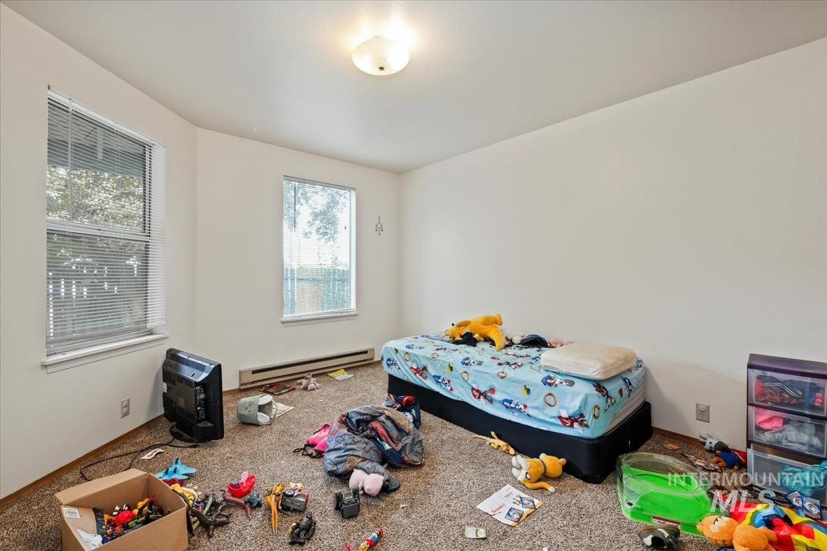 33 South Mike Street Boise, ID 83705 - Photo 43 of 50 Carpeted bedroom featuring a baseboard radiator