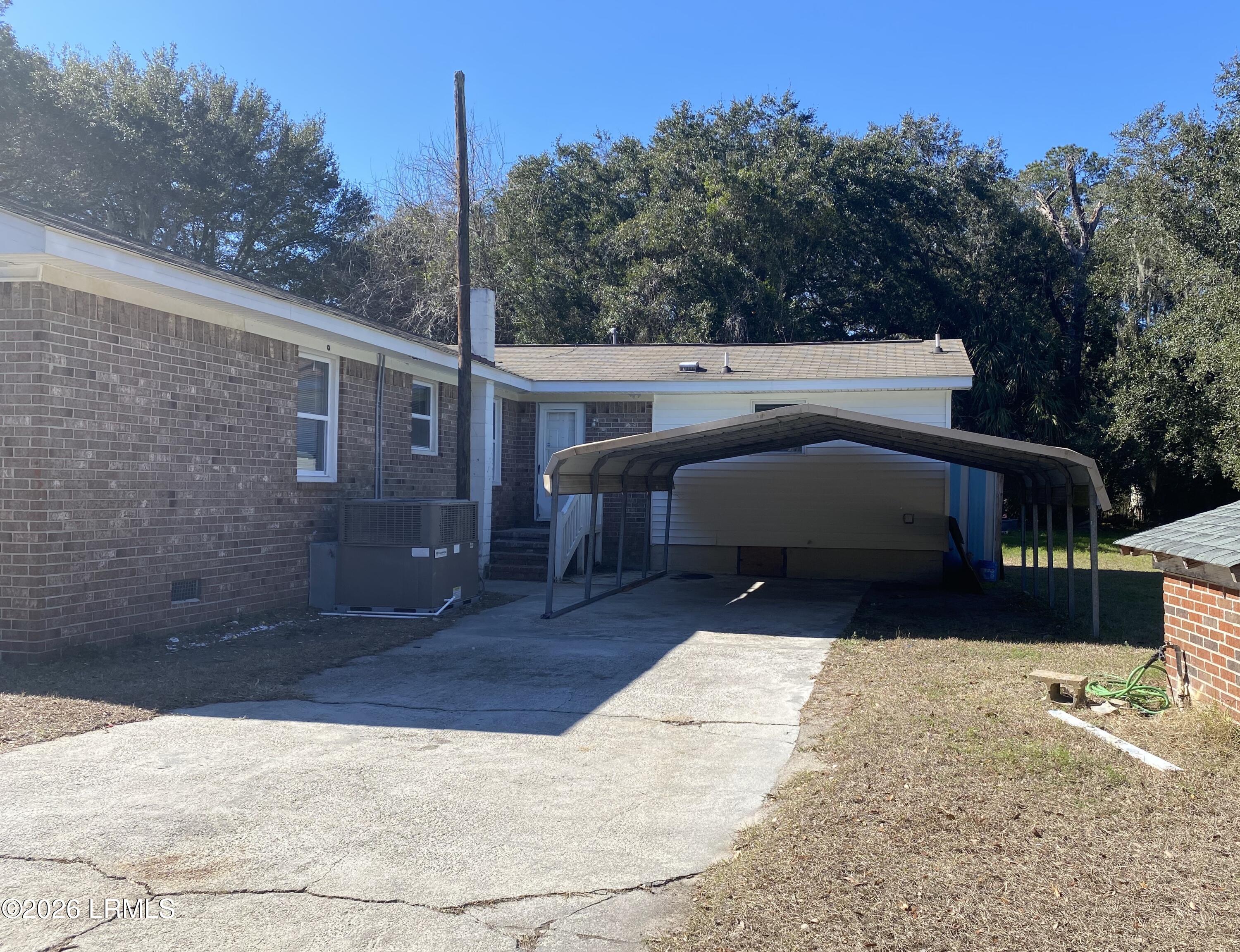 22 Pine Grove Road Beaufort, SC 29906 - Photo 4 of 10 back and carport