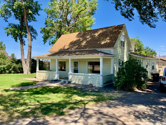 630 North Main Street Monroe, UT 84754 - Photo 2 of 63 View of front of property with covered porch, roof with shingles, and a front lawn