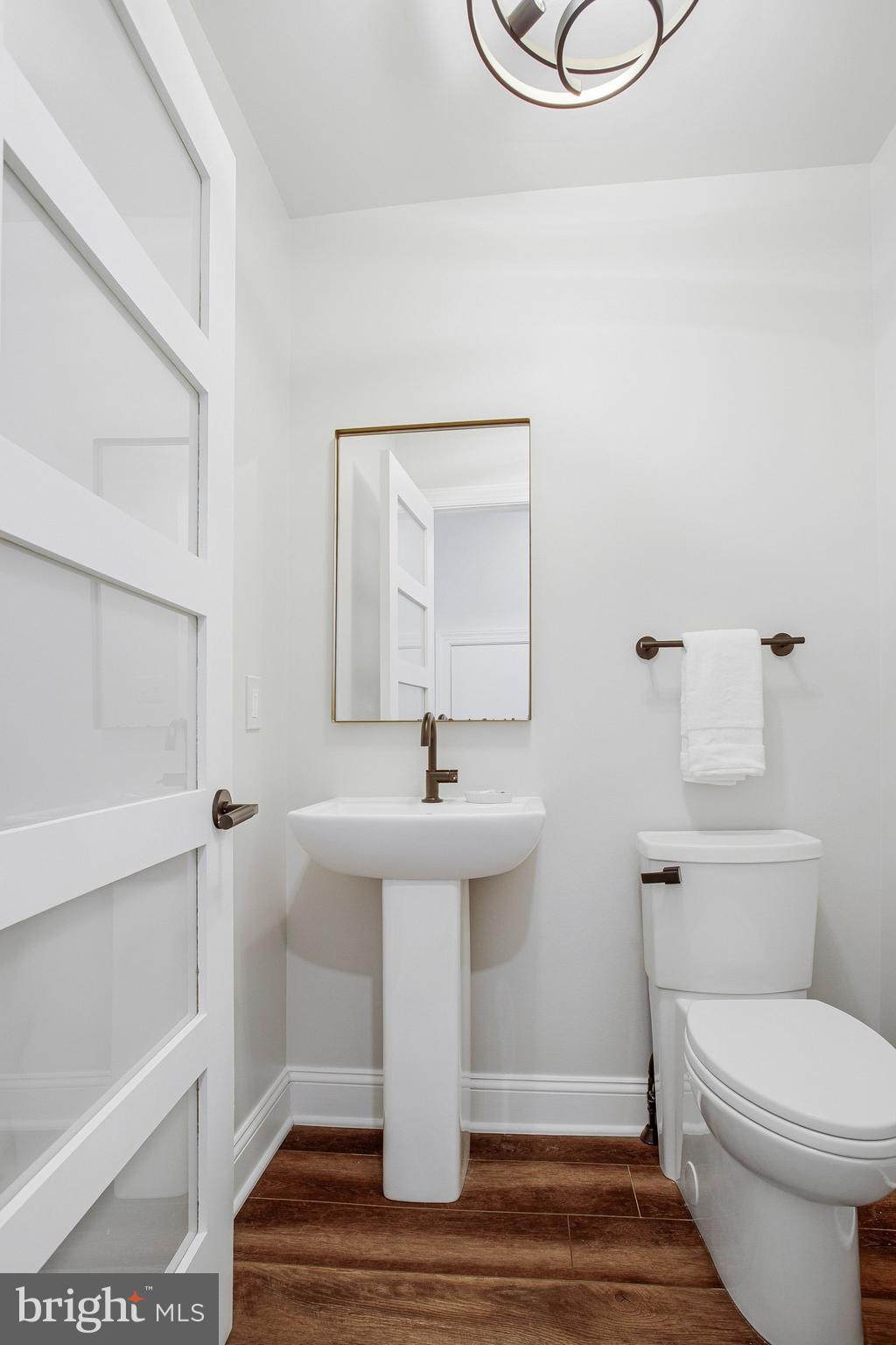 6146 Drum Point Road Deale, MD 20751 - Photo 34 of 75 a bathroom with a sink a toilet and shower