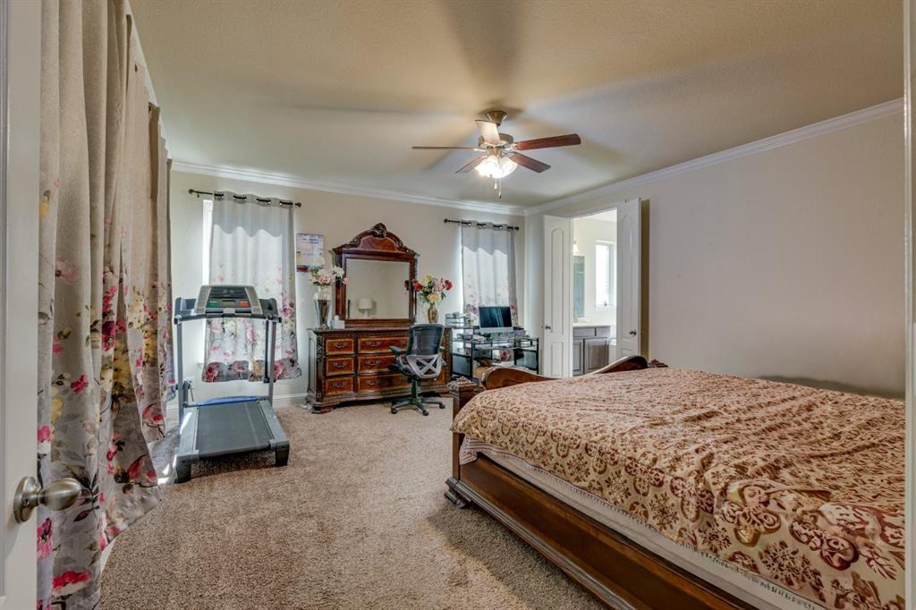 336 Red Hill Road Sunnyvale, TX 75182 - Photo 19 of 36 a bedroom with bed and a large window