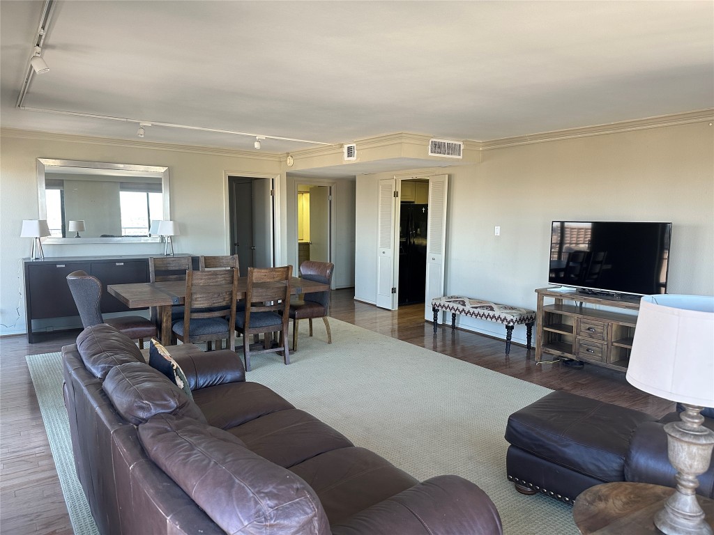 1122 Colorado Street, Unit 1902 Austin, TX 78701 - Photo 4 of 15 a living room with furniture and a flat screen tv