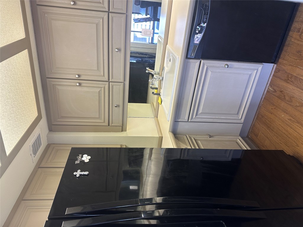 1122 Colorado Street, Unit 1902 Austin, TX 78701 - Photo 8 of 15 a kitchen with stainless steel appliances granite countertop a refrigerator and a sink