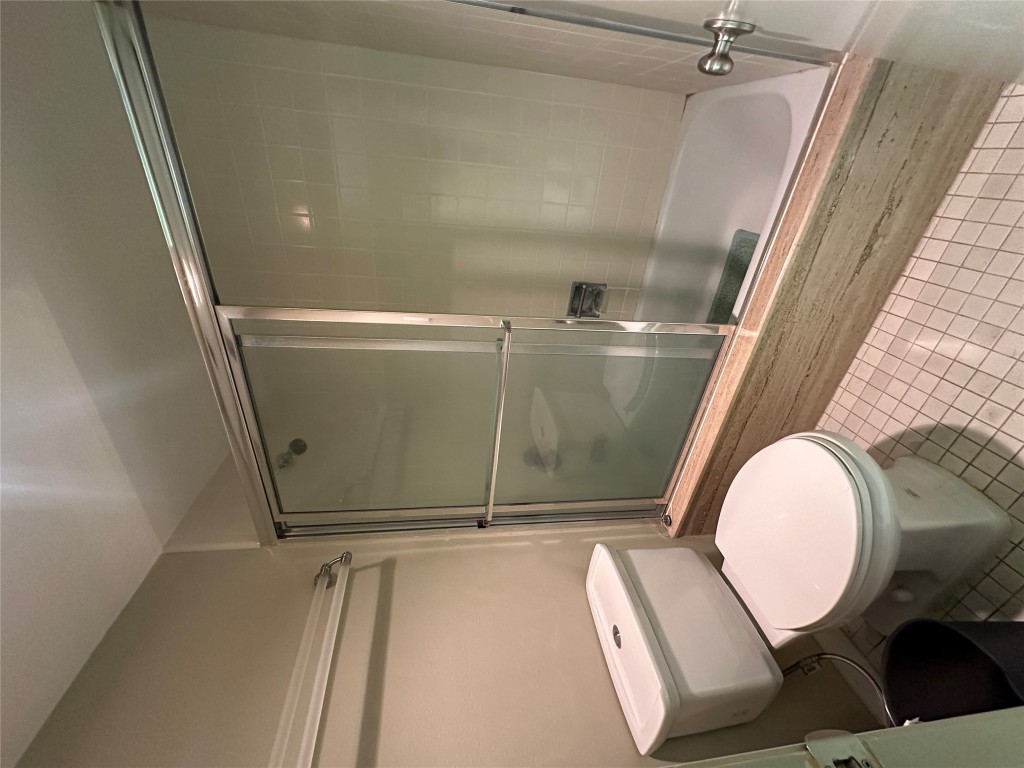 1122 Colorado Street, Unit 1902 Austin, TX 78701 - Photo 10 of 15 a bathroom with a toilet and a shower