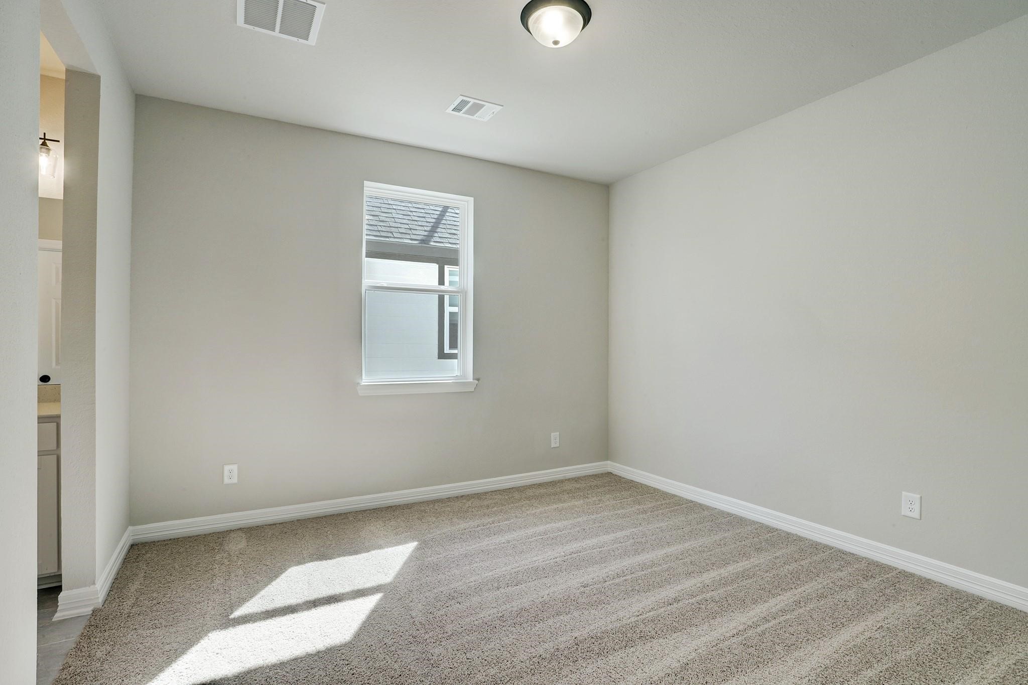 9522 Caddo Ridge Lane Cypress, TX 77433 - Photo 20 of 38 an empty room with a window