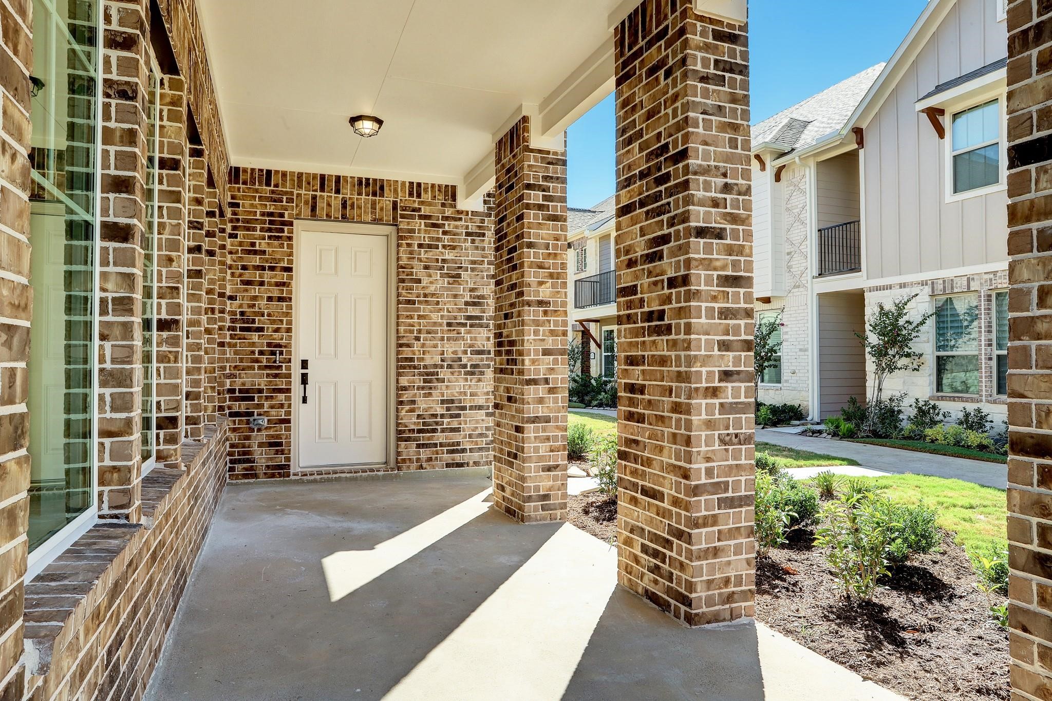 9522 Caddo Ridge Lane Cypress, TX 77433 - Photo 2 of 38 a view of a balcony with a couple of cars parked in front of house
