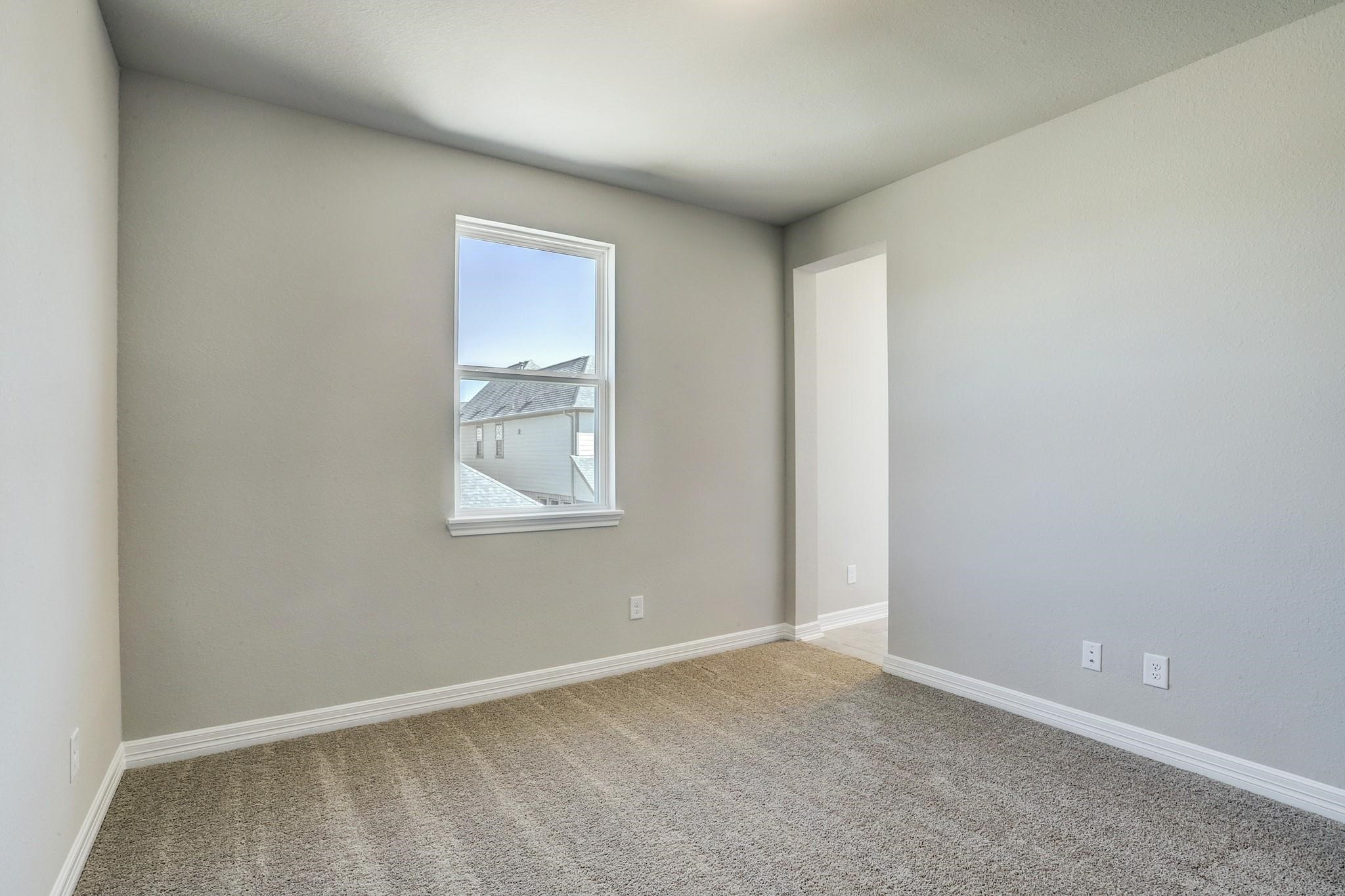 9522 Caddo Ridge Lane Cypress, TX 77433 - Photo 23 of 38 an empty room with windows and closet