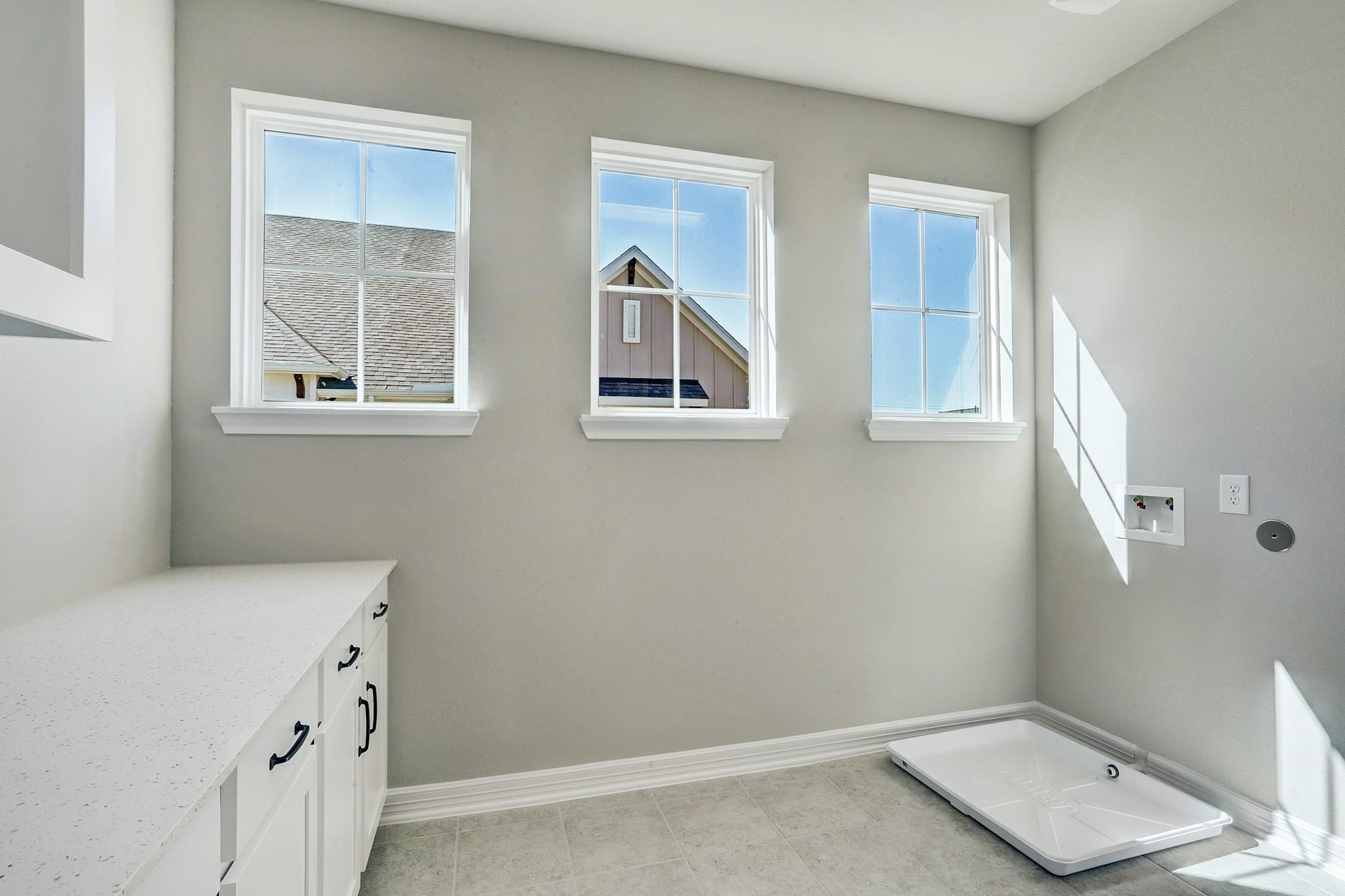 9522 Caddo Ridge Lane Cypress, TX 77433 - Photo 27 of 38 a bathroom with a tub sink and window