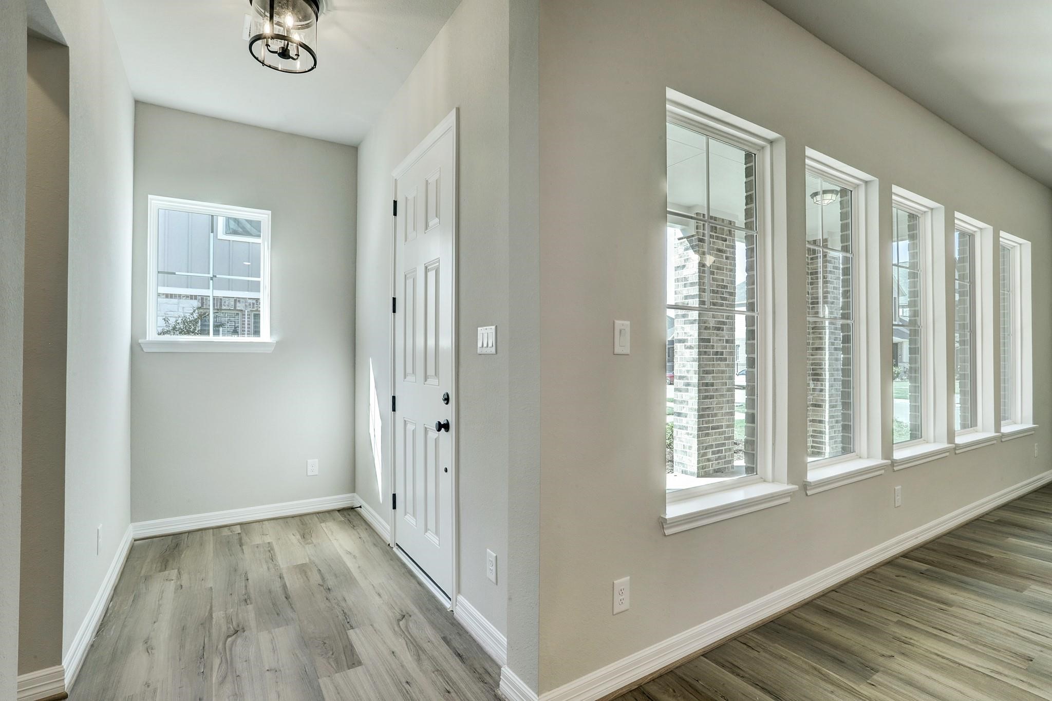 9522 Caddo Ridge Lane Cypress, TX 77433 - Photo 3 of 38 a view of a livingroom with wooden floor and a window