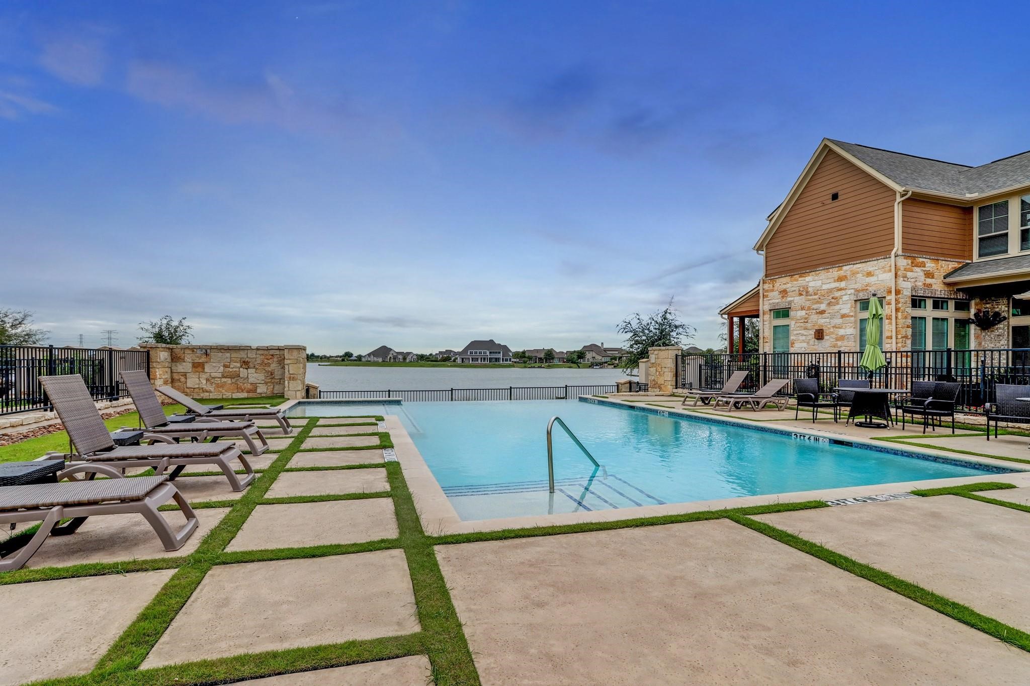 9522 Caddo Ridge Lane Cypress, TX 77433 - Photo 34 of 38 a view of a lake with a terrace