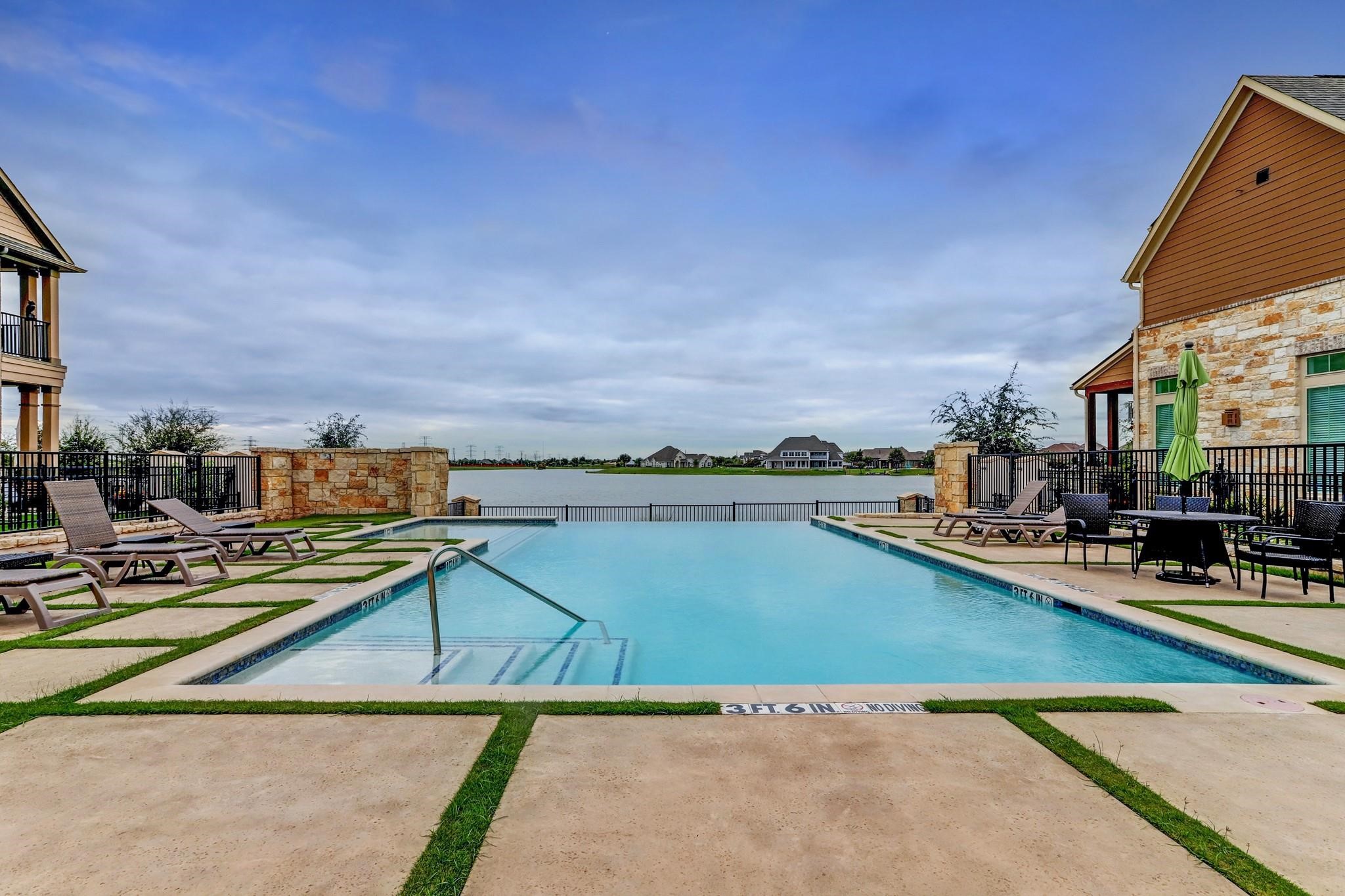 9522 Caddo Ridge Lane Cypress, TX 77433 - Photo 35 of 38 a view of swimming pool with outdoor seating and city view
