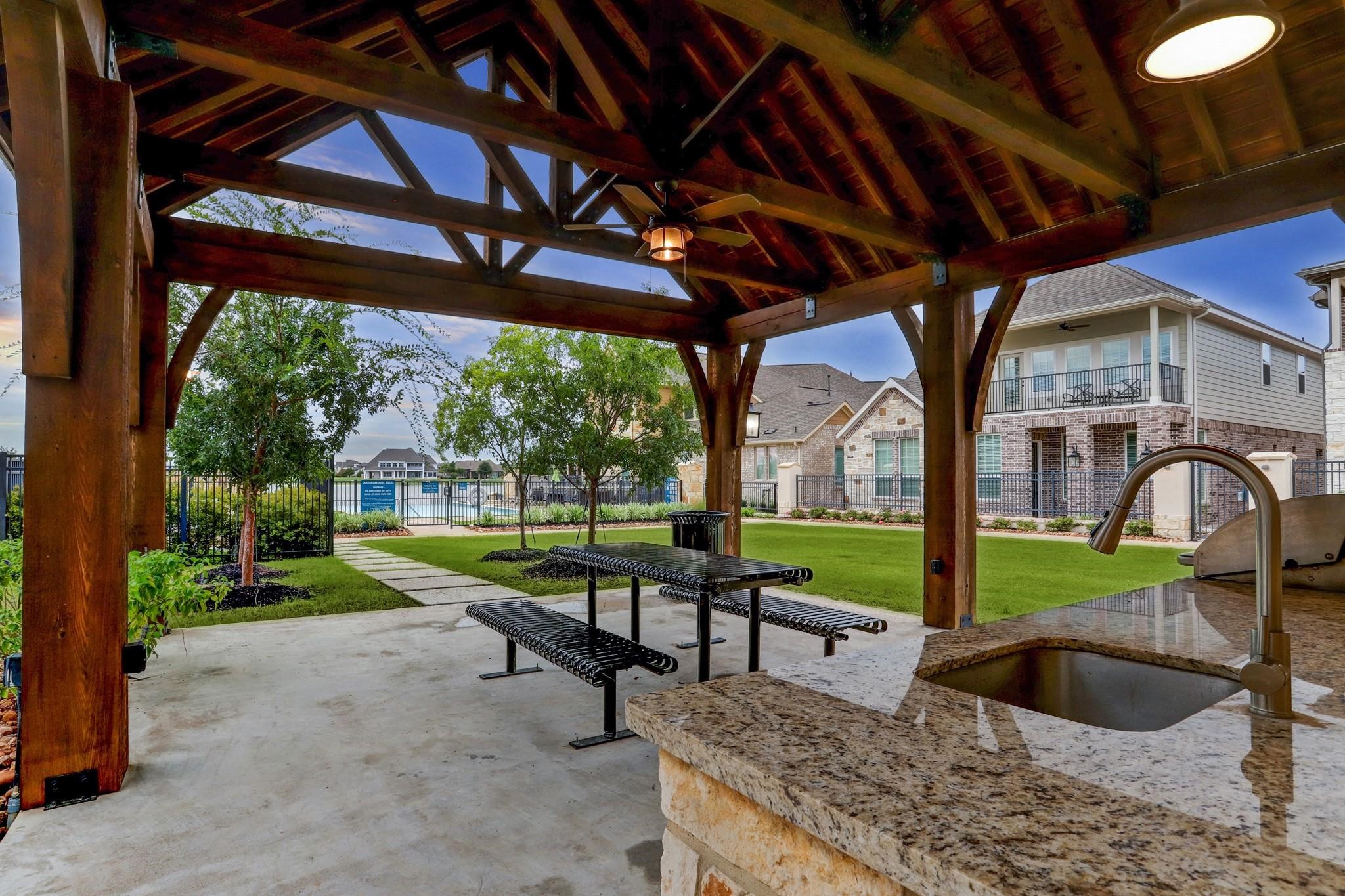 9522 Caddo Ridge Lane Cypress, TX 77433 - Photo 38 of 38 a view of a swimming pool with a patio