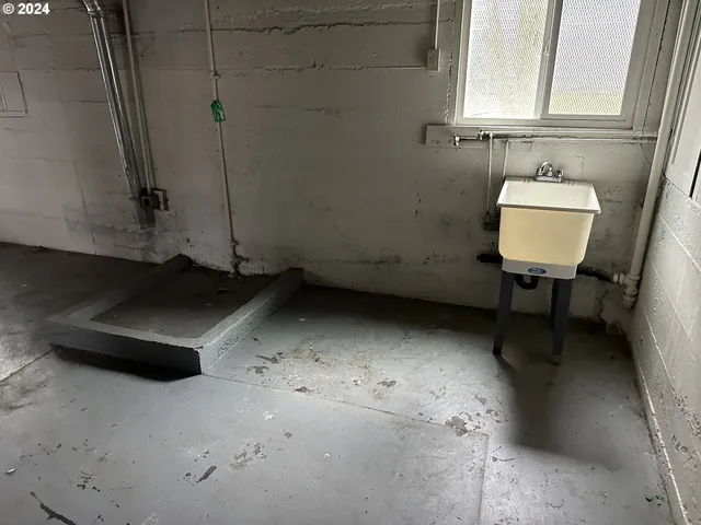a bathroom with a sink a toilet and mirror