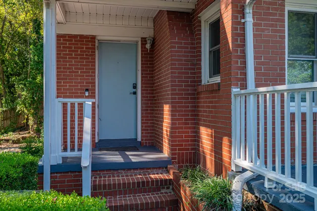 front view of a house with a bench