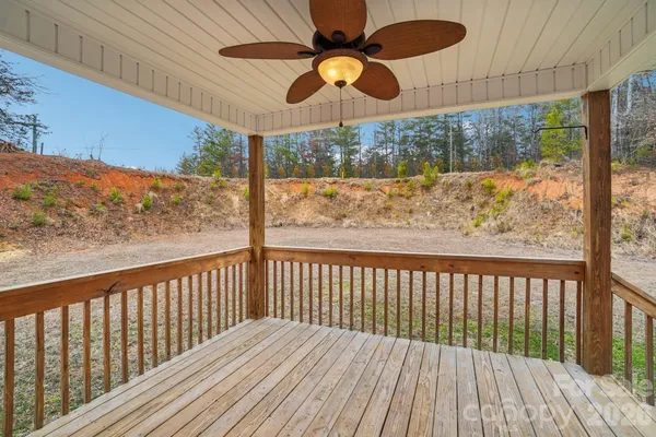 a view of a balcony with furniture