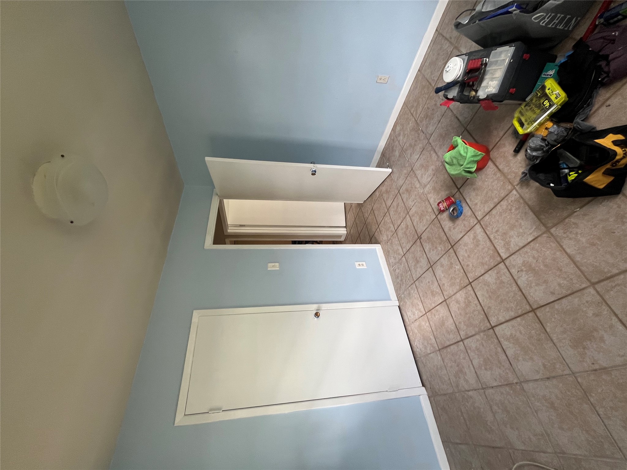 1607 Lightsey Road, Unit A Austin, TX 78704 - Photo 13 of 17 Room featuring light blue walls, ceramic tile flooring, a white ceiling, and a flush-mount ceiling light fixture