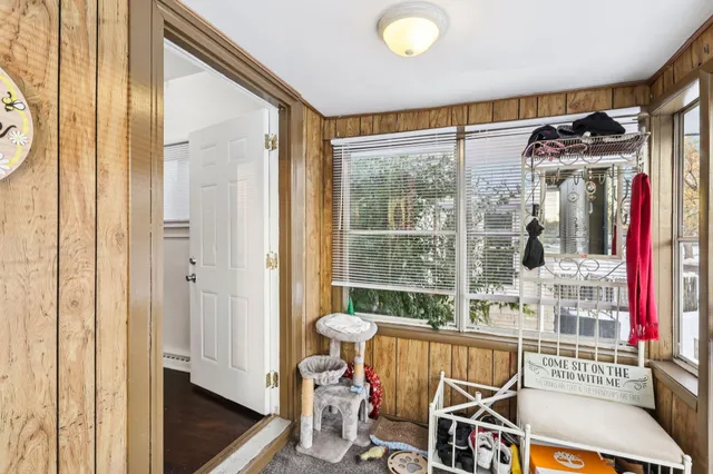 a view of a room with furniture and front door