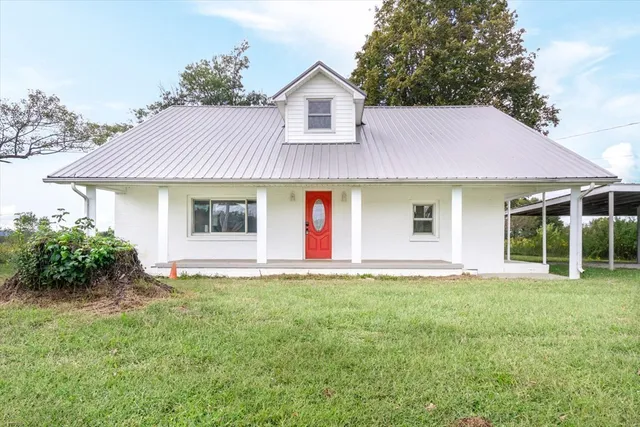 front view of a house with a yard