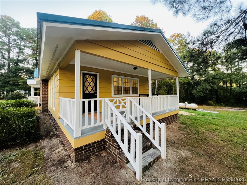 10481 Bostic Road Laurinburg, NC 28352 - Photo 13 of 15 front view of a house with a yard