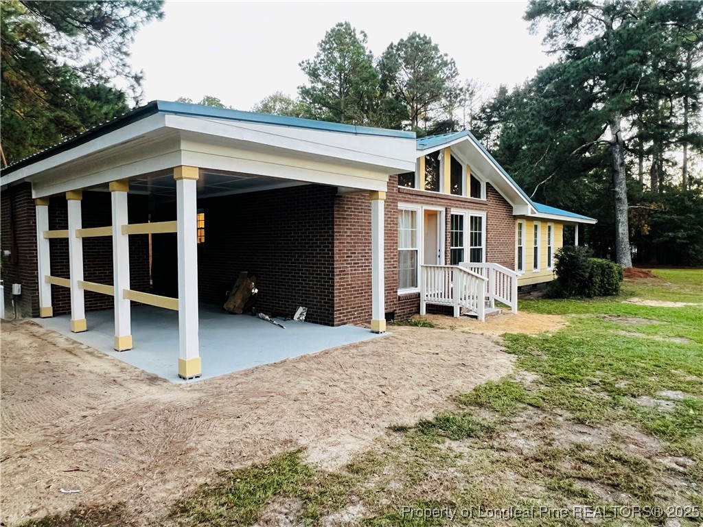 10481 Bostic Road Laurinburg, NC 28352 - Photo 14 of 15 a house with a outdoor space