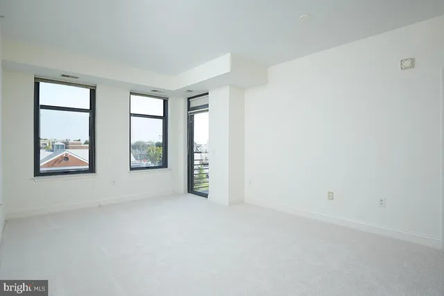 an empty room with windows