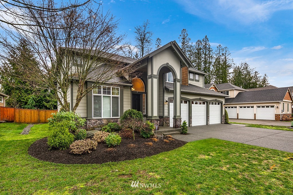 22214 151st Place Southeast Monroe, WA 98272 - Photo 1 of 28 a front view of a house with a garden