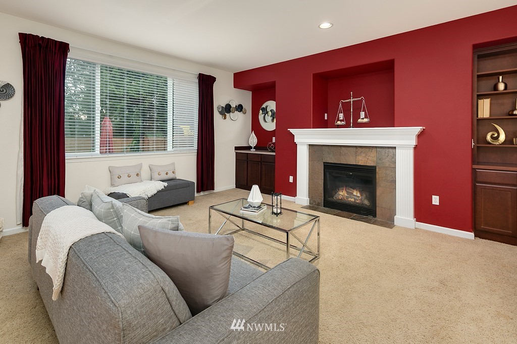 22214 151st Place Southeast Monroe, WA 98272 - Photo 11 of 28 a living room with furniture and a fireplace