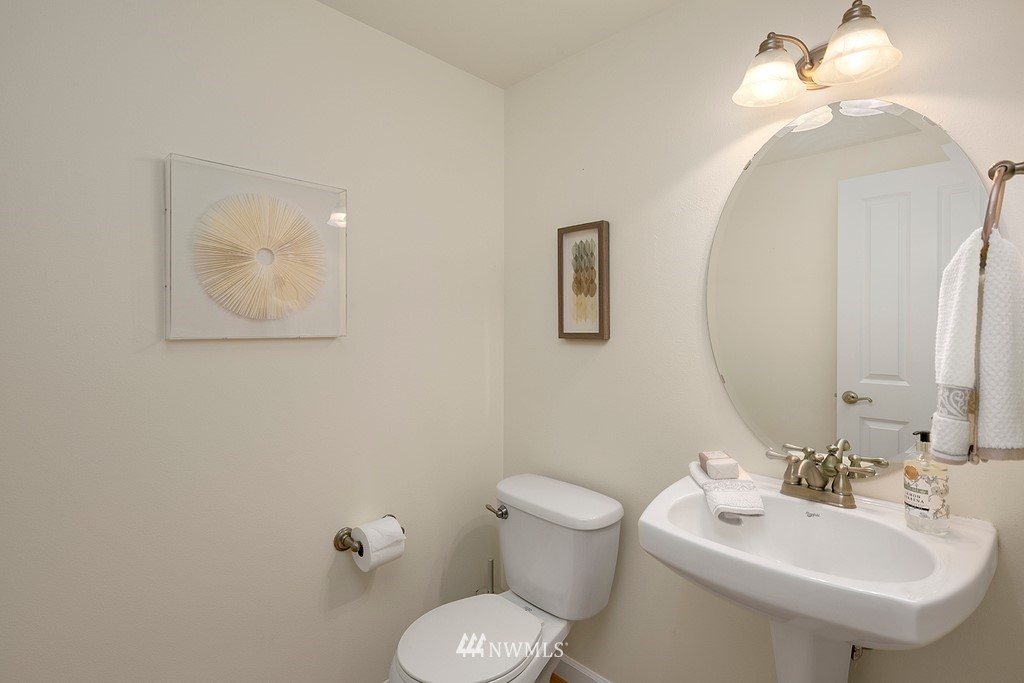 22214 151st Place Southeast Monroe, WA 98272 - Photo 13 of 28 a bathroom with a toilet sink and mirror