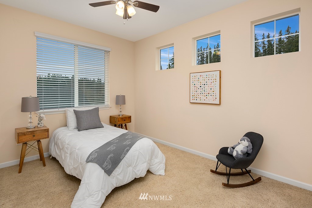 22214 151st Place Southeast Monroe, WA 98272 - Photo 16 of 28 a bedroom with a bed and a chair