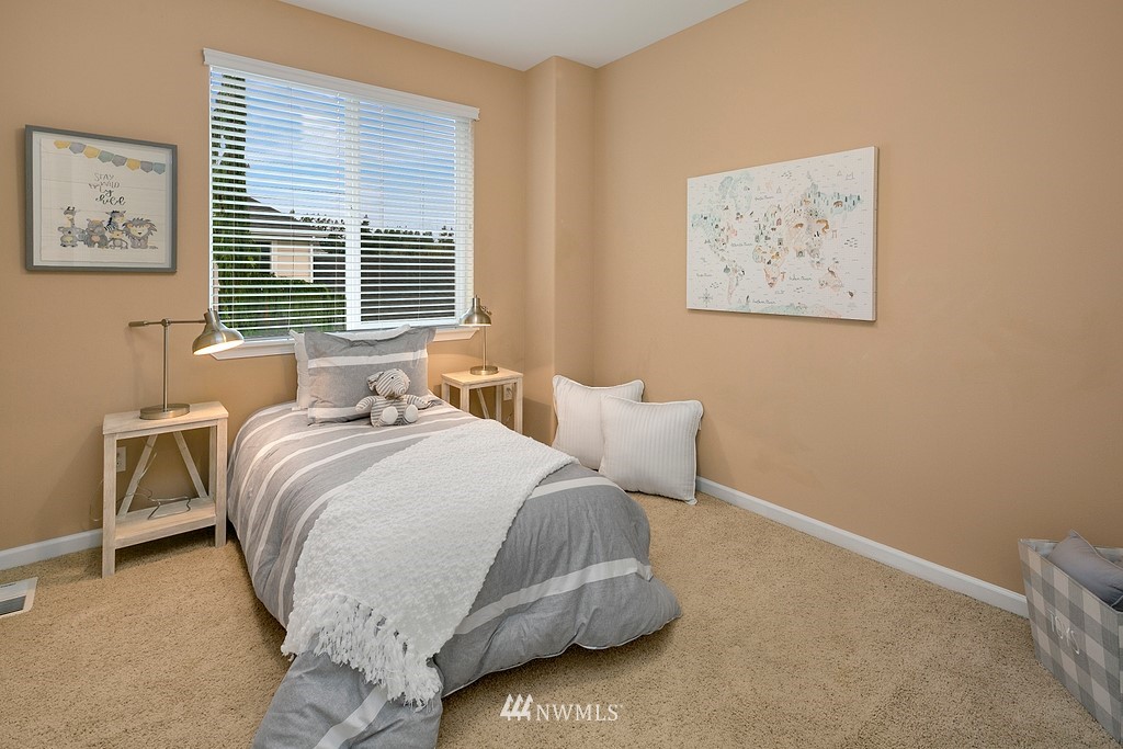 22214 151st Place Southeast Monroe, WA 98272 - Photo 18 of 28 a bedroom with a bed and a night stand