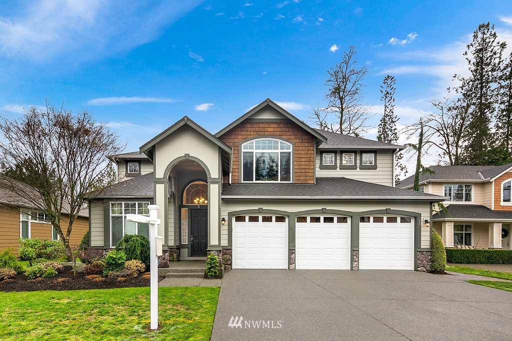 22214 151st Place Southeast Monroe, WA 98272 - Photo 2 of 28 a front view of a house with garden