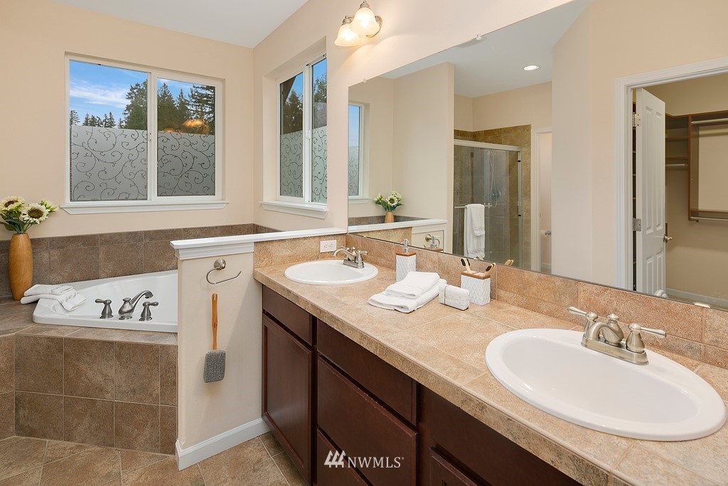 22214 151st Place Southeast Monroe, WA 98272 - Photo 23 of 28 a bathroom with a sink double vanity and a mirror