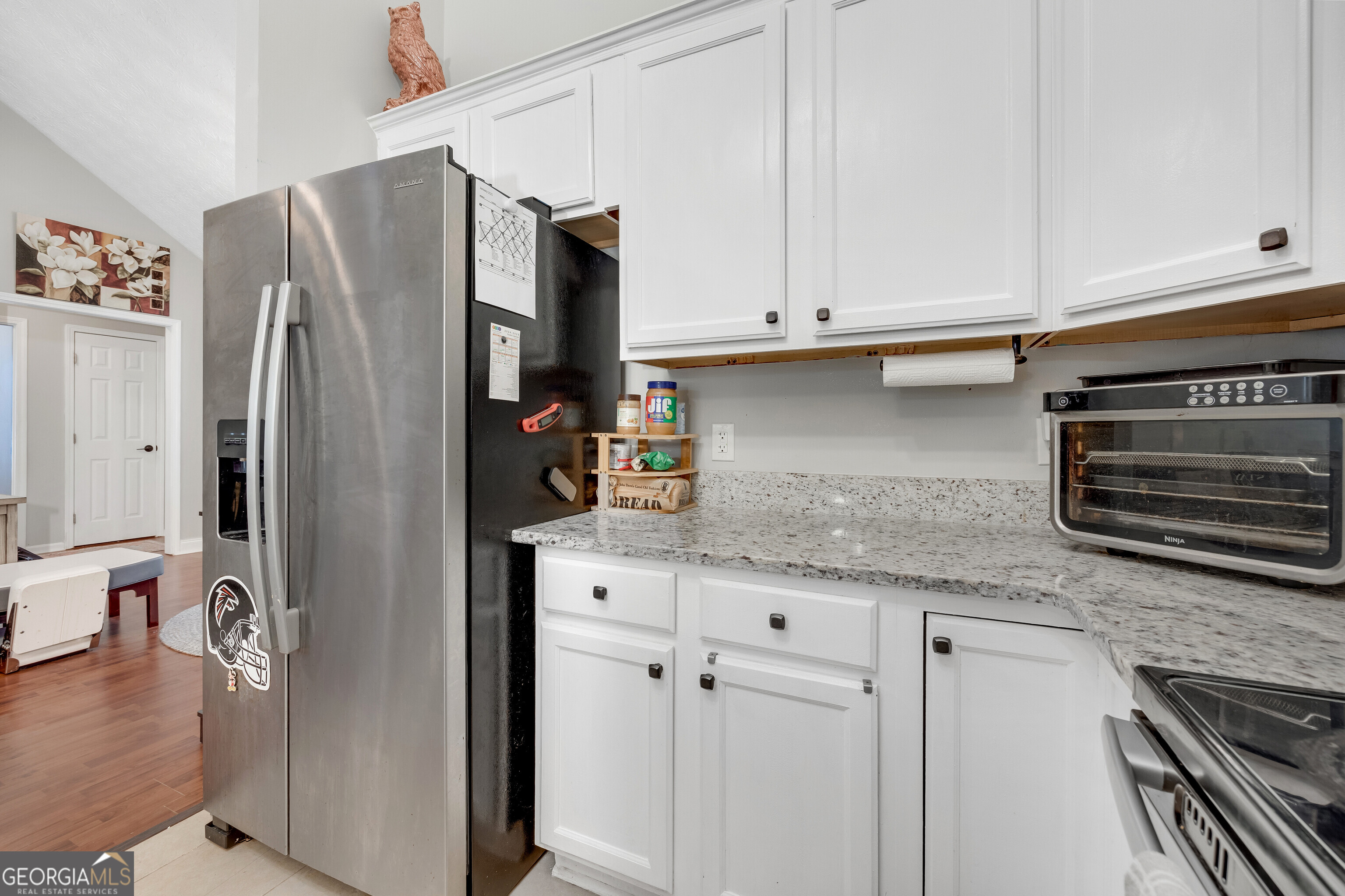 119 Cedar Ridge Drive LaGrange, GA 30241 - Photo 12 of 34 a kitchen with stainless steel appliances granite countertop a refrigerator and a stove