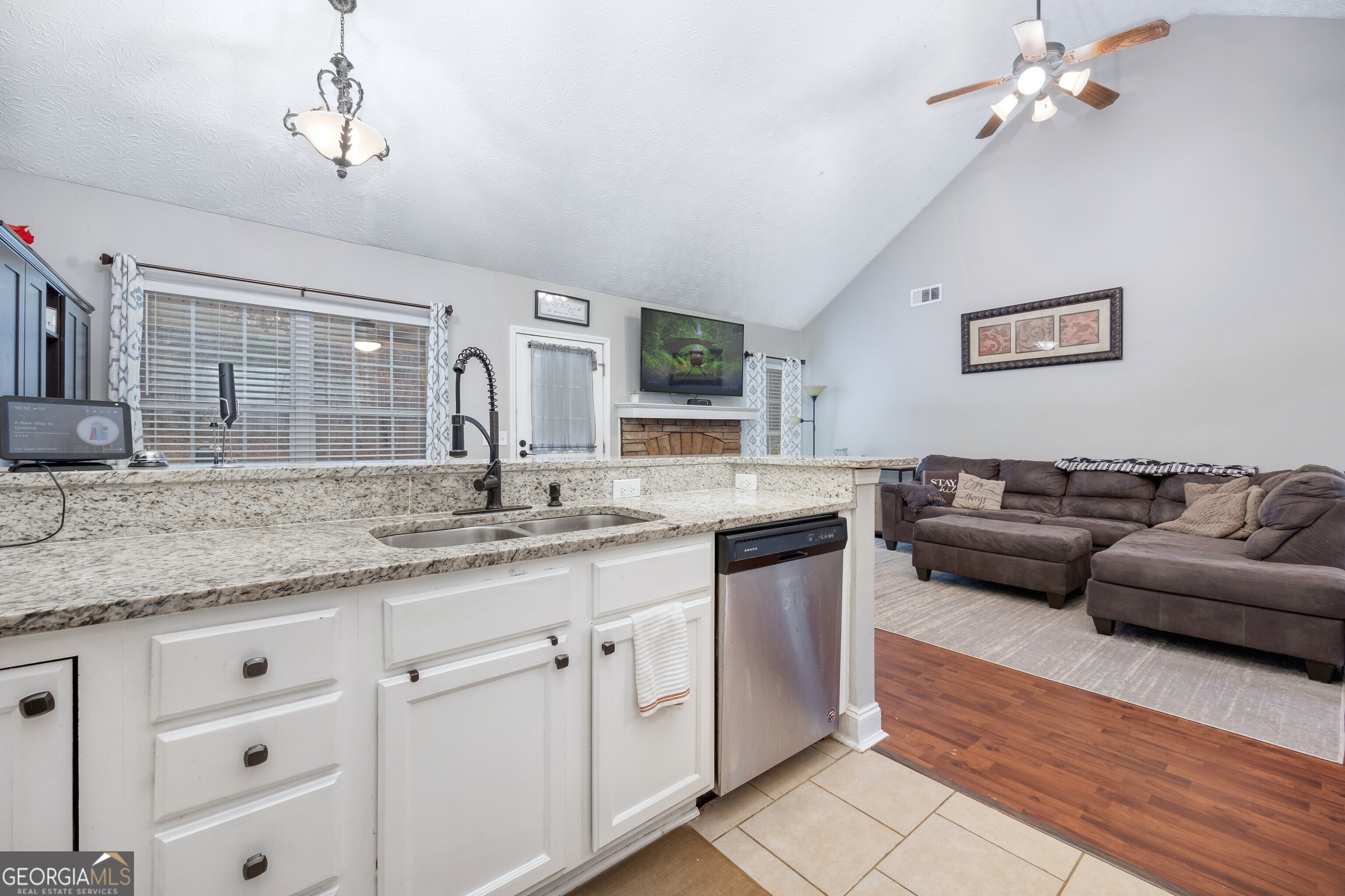 119 Cedar Ridge Drive LaGrange, GA 30241 - Photo 13 of 34 a spacious bathroom with a granite countertop sink a mirror and a bathtub
