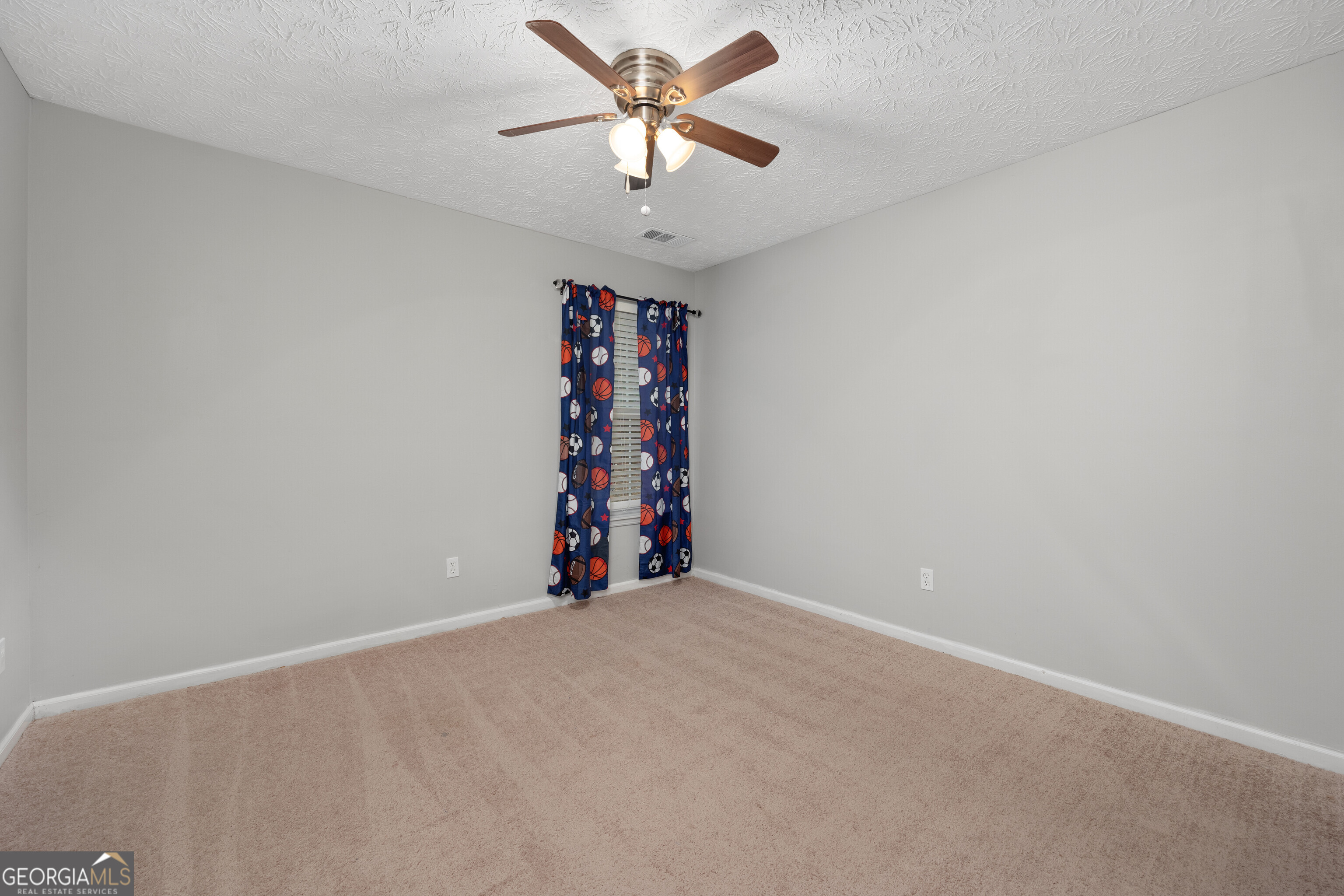 119 Cedar Ridge Drive LaGrange, GA 30241 - Photo 15 of 34 a view of a room with a ceiling fan and carpet