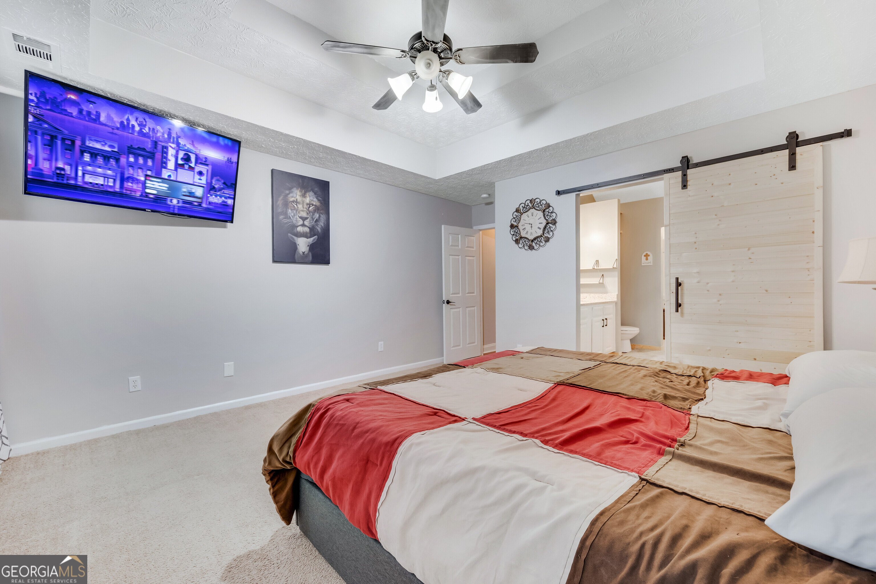 119 Cedar Ridge Drive LaGrange, GA 30241 - Photo 23 of 34 a bedroom with a bed and a chandelier