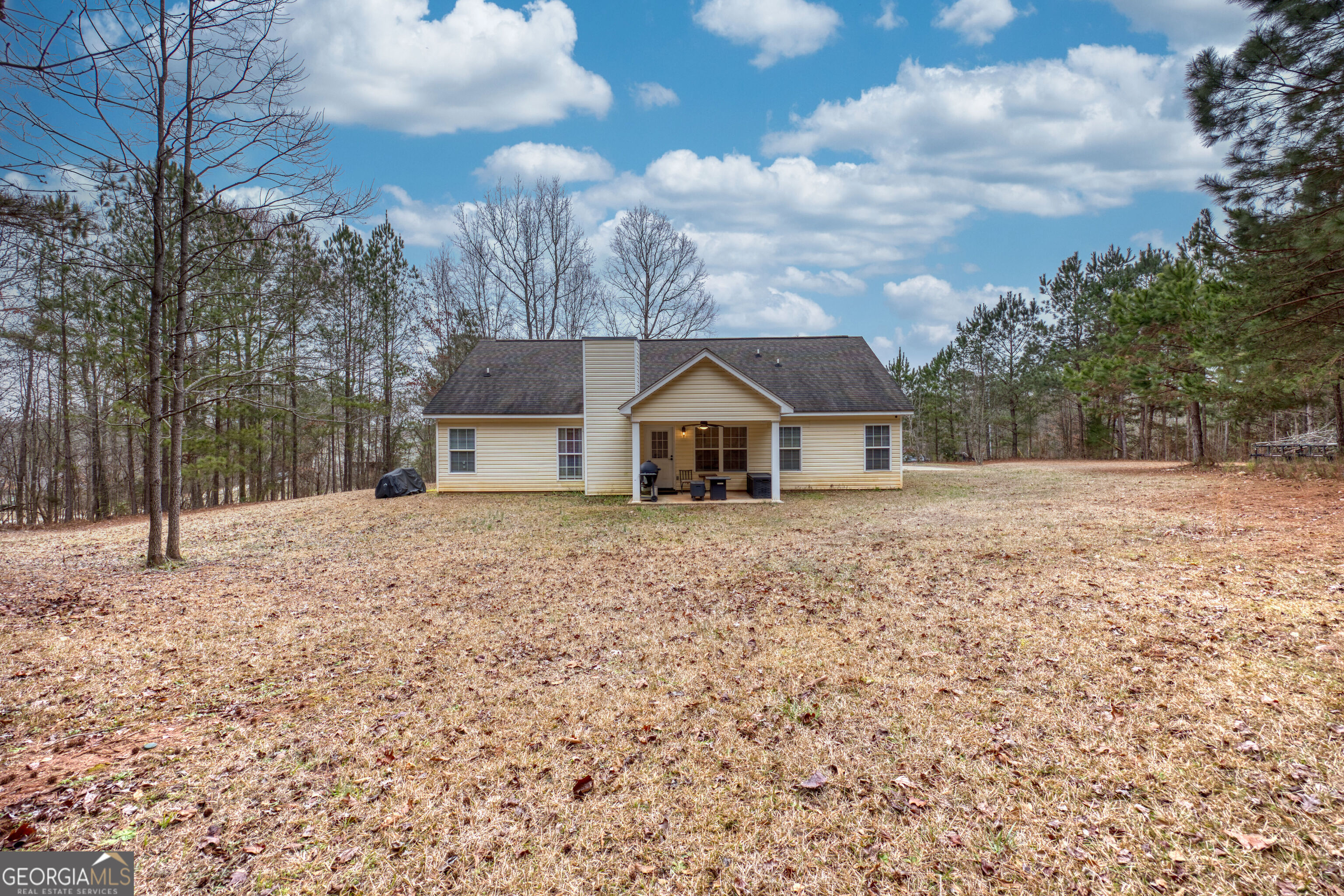 119 Cedar Ridge Drive LaGrange, GA 30241 - Photo 30 of 34 a wooden house with trees in the background