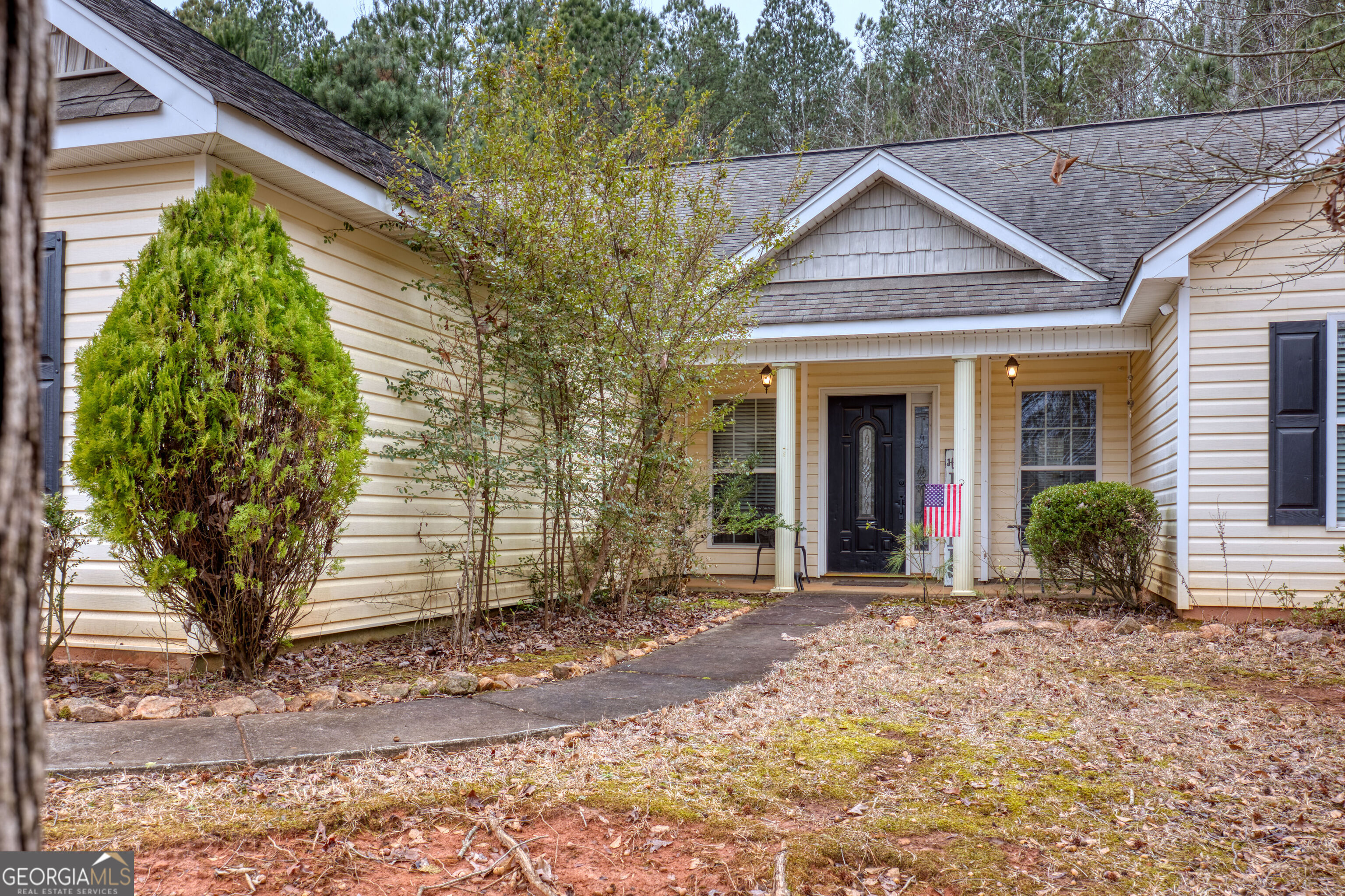 119 Cedar Ridge Drive LaGrange, GA 30241 - Photo 4 of 34 a front view of a house with garden