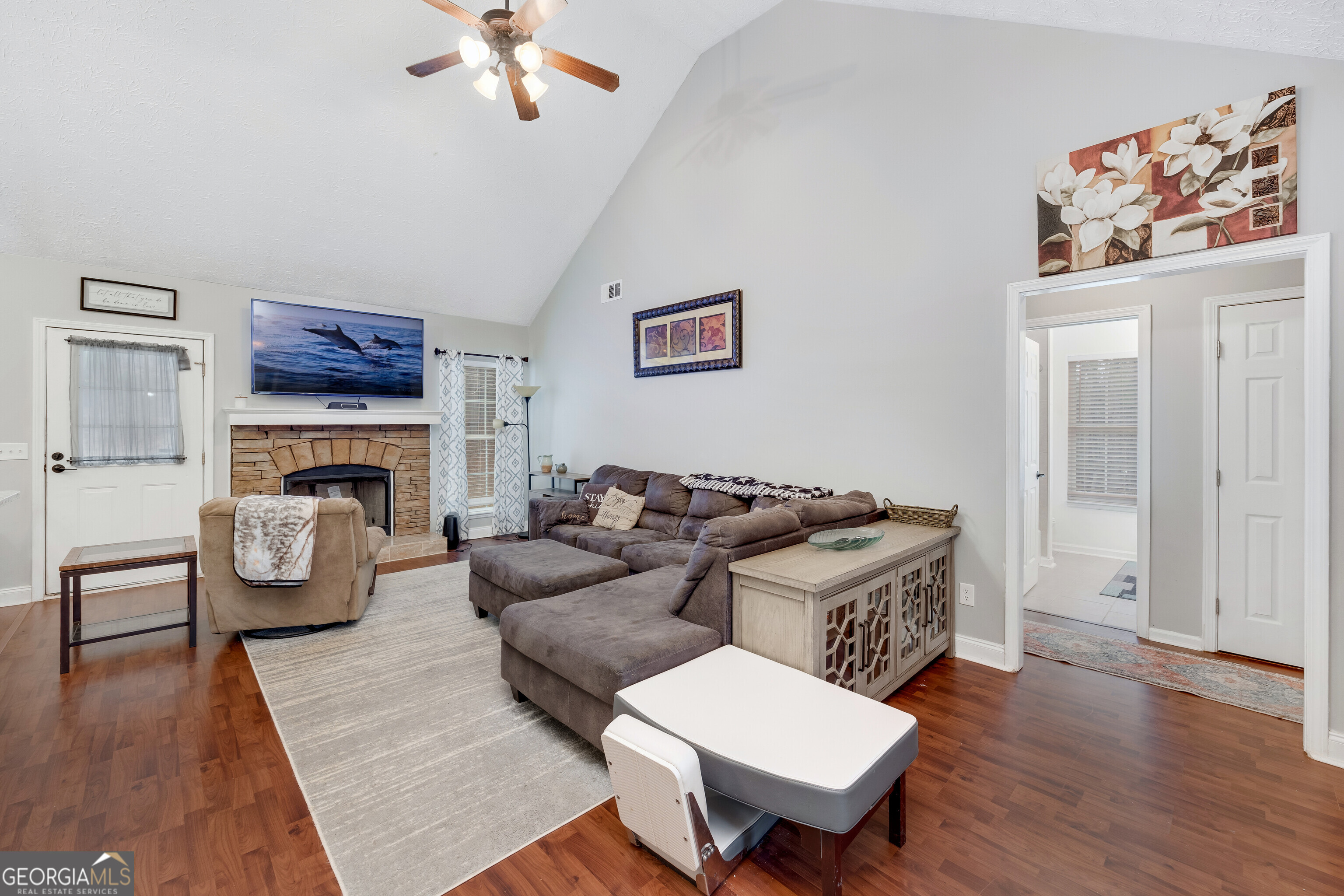119 Cedar Ridge Drive LaGrange, GA 30241 - Photo 5 of 34 a living room with furniture and a fireplace