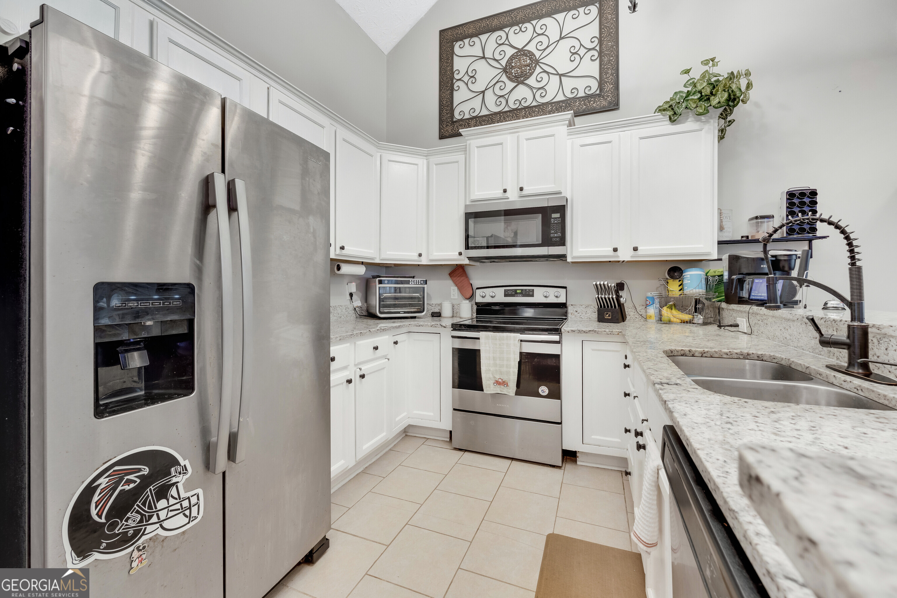119 Cedar Ridge Drive LaGrange, GA 30241 - Photo 10 of 34 a kitchen with stainless steel appliances granite countertop a refrigerator sink and stove