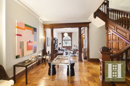 857 Carroll Street Brooklyn, NY 11215 - Photo 1 of 1 a living room with furniture and a floor to ceiling window